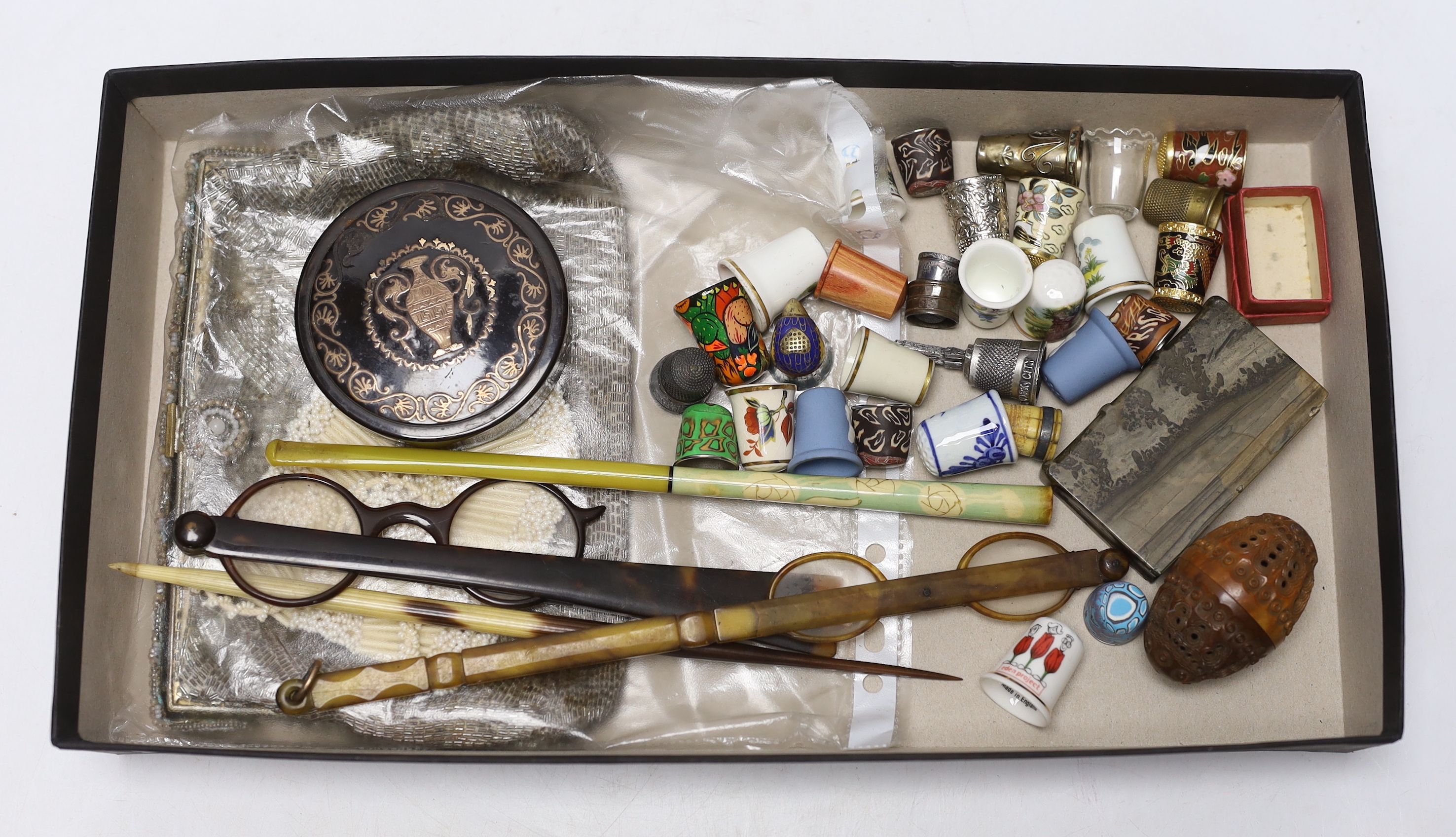 A 19th century gilt metal inlaid tortoiseshell snuff box together with a group of thimbles and sundries